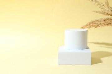 Props for product photography. Different podiums on a colored background