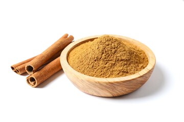 Cinnamon sticks and cinnamon powder in a bowl on a white background