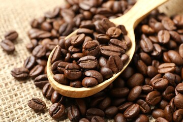 Spoon with coffee beans on burlap