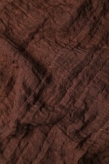 Brown fabric background, top view