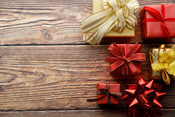Assorted artisanal gift boxes on wooden background.