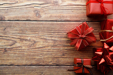 Assorted artisanal gift boxes on wooden background.