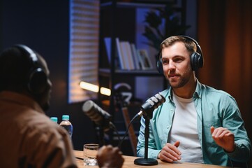 Show host and guest meeting to stream podcast episode together, creating online content with live...