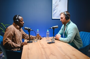 Show host and guest meeting to stream podcast episode together, creating online content with live...