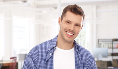 Portrait of young white man at home in 30s. Copy Space.