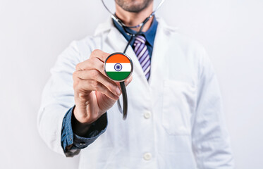 Healthcare System India, doctor holding stethoscope. India health and medical insurance concept