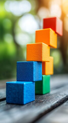 Colorful building blocks stacked in creative arrangement outdoors