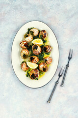 Baked snails with butter.