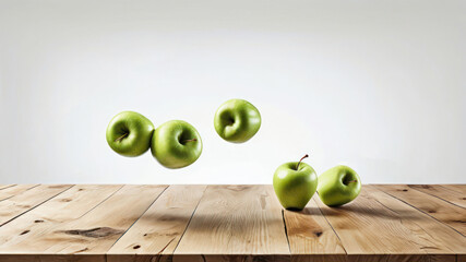 Apples on a wooden table and fly. The fruits are green - ripe and juicy. The background is a white wall. Vertical illustration with space for text.