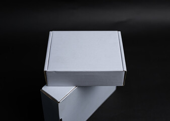 Two boxes stacked on top of each other The top box is slightly offset