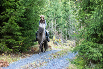 Icelandic horse riding. Rider has werewolf theme outfit