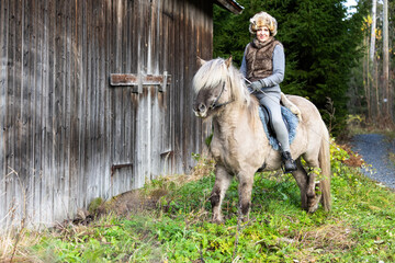 Icelandic horse riding. Rider has werewolf theme outfit