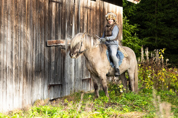 Icelandic horse riding. Rider has werewolf theme outfit