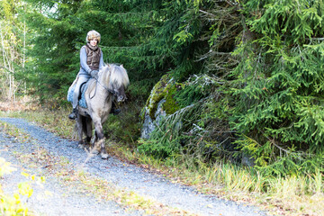 Icelandic horse riding. Rider has werewolf theme outfit