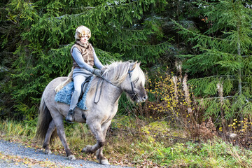 Icelandic horse riding. Rider has werewolf theme outfit