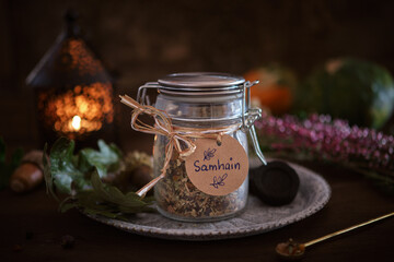 Incense mixture for Samhain in a jar (frankincense, copal, myrrh, cedarwood, rosemary). Samhain is a celtic seasonal festival marking the beginning of winter.