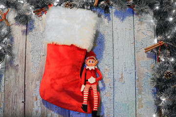 christmas stocking hanging on a wooden door