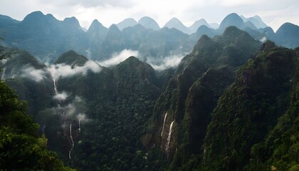 Obraz premium Mist-Covered Peaks of the Phou Khao Khouay Mountains