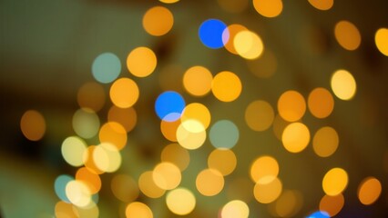 Obraz premium Vibrant Golden Bokeh Lights: Perfect for Holiday Decorations, Festive Backgrounds, and Celebratory Events