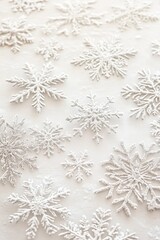 Close-up of delicate snowflakes glistening on a soft white background, perfect for winter-themed designs