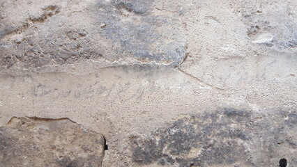 A cracked desert terrain with curled soil fragments, highlighting the effects of arid climates and the natural patterns formed by heat and erosion.