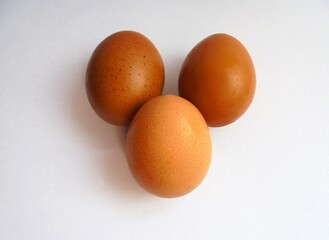 three eggs on a white background