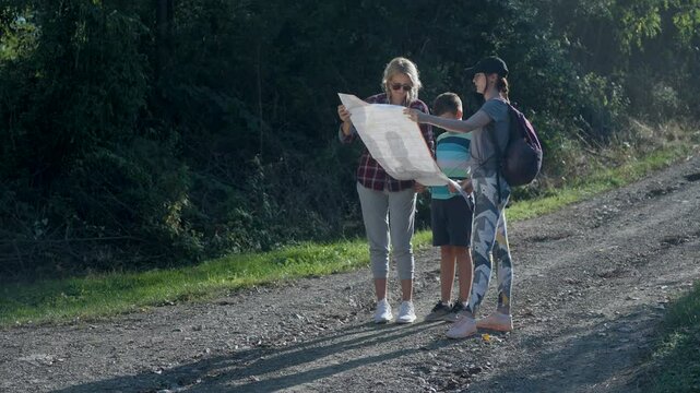 Family on road trip,looking at a map