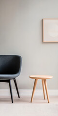 Minimalist living room setup with a gray chair and wooden table against a light wall