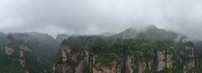 Aerial drone panorama capturing Zhangjiajie’s mystical peaks and cloudy landscape in China, famously inspiring the Avatar movie’s floating mountains