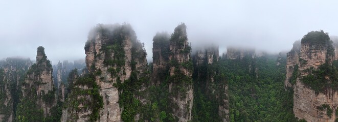 Aerial drone panorama capturing Zhangjiajie’s mystical peaks and cloudy landscape in China, famously inspiring the Avatar movie’s floating mountains