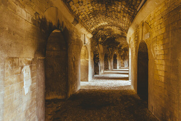 The amphitheater of Arles (arena) was created following Tiberius Caesar Augustus's order to urbanise the city.  This elliptical-shaped Roman amphitheatre has 60 semi-circular arches.
