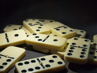 Board game Domino. Bones. The domino principle. Responsibility, collapse and fall. dice
