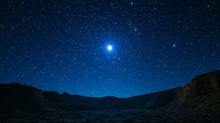 Obraz premium A bright star shines in the night sky with many other stars visible.