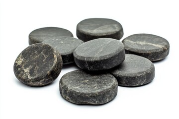 Natural round black stones arranged artfully on a white background. Perfect for decoration or mindfulness practices. Enhance your space with calming elements. Generative AI