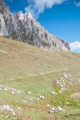 Part of Fisht-Oshten massif with green hill slopes in the foreground, Republic of Adygea, Russia