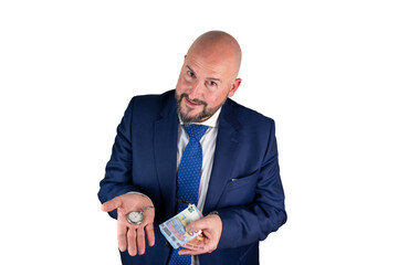 portrait of businessman in blue suit and tie with friendly expression showing a watch and banknotes isolated on white background