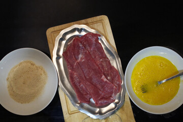 veal meat schnitzel breaded with egg