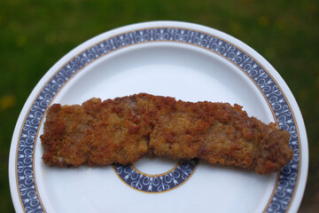 veal meat schnitzel breaded with egg