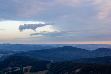 dawn against the backdrop of mountains and a small town