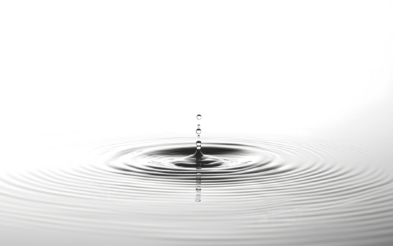 single water droplet creates ripples on calm surface, capturing moment of tranquility and reflection. concentric circles spread outward, symbolizing peace and harmony