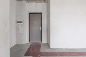 interior of the apartment without decoration in gray colors. rough finish