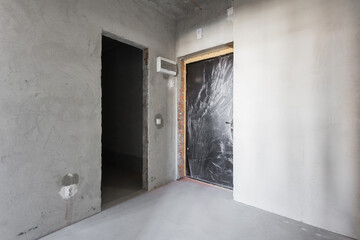 interior of the apartment without decoration in gray colors. rough finish