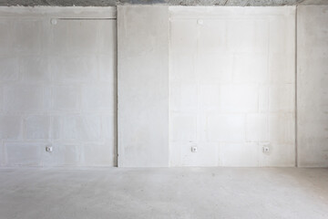 interior of the apartment without decoration in gray colors. rough finish