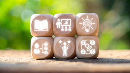 Creative Workshop Concept with Icons Representing Learning, Teamwork, and Innovation on Wooden Blocks