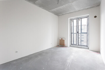 interior of the apartment without decoration in gray colors. rough finish
