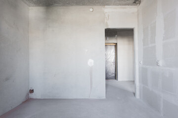 interior of the apartment without decoration in gray colors. rough finish