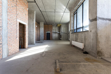 interior of the apartment without decoration in gray colors. rough finish