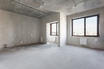 interior of the apartment without decoration in gray colors. rough finish