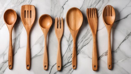 eco-friendly wooden kitchen utensils on marble