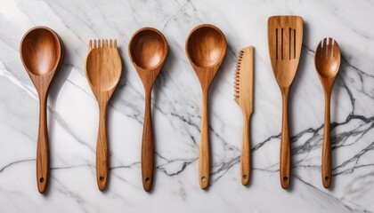 eco-friendly wooden kitchen utensils on marble